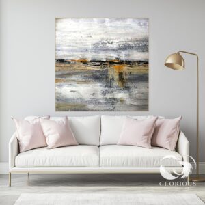 Large abstract painting in gray, white, and gold tones with textured brushstrokes