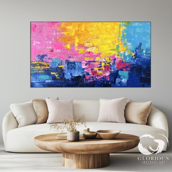 Oversized vibrant abstract art displayed in a contemporary office space.