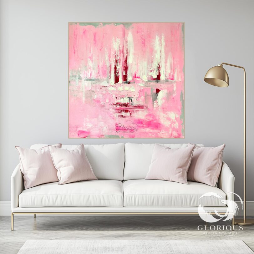 Textured pink abstract painting on a canvas, displayed in a modern living room.