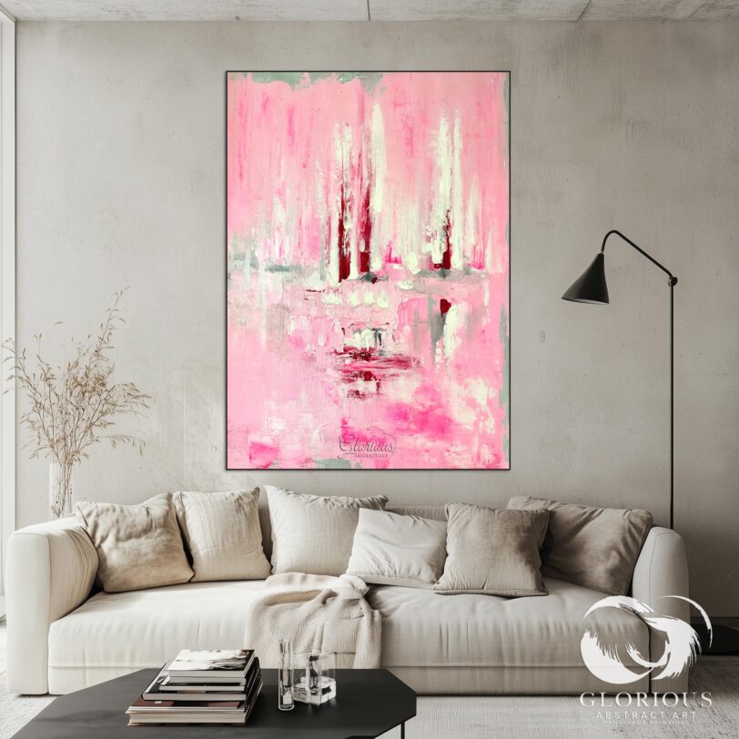 Close-up of textured details and layered pink tones on an abstract painting.