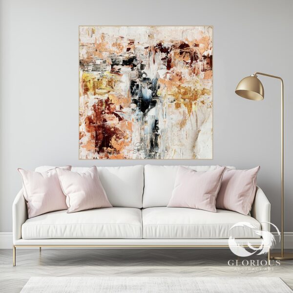 Neutral abstract painting with textured beige and gold brushstrokes, styled in a modern living room