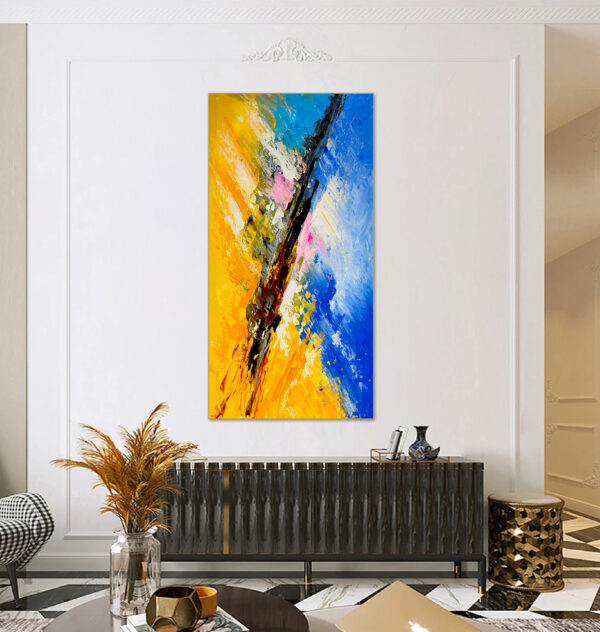 Oversized blue and yellow abstract artwork with dynamic composition