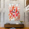 Close-up of abstract painting showcasing bold orange, red, and white strokes