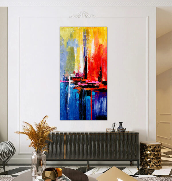 Hand-painted abstract wall art with vibrant brushstrokes in red, blue, and yellow.