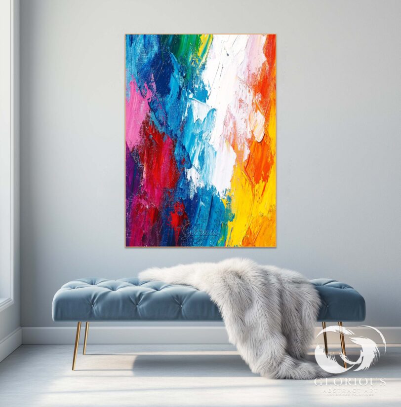 Close-up of brushstrokes in a multicolor abstract painting showcasing blue, red, and yellow hues