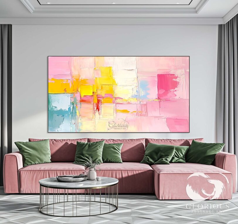Large modern abstract painting in pink, yellow, and blue tones, displayed in a home office setting.
