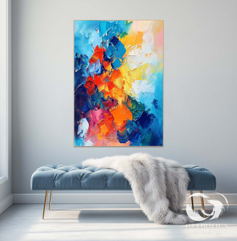 Blue and orange abstract painting displayed in a modern living room.