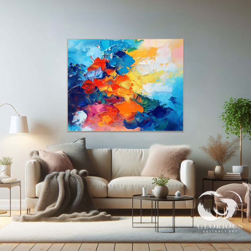 Close-up of textured brushstrokes in blue and orange abstract painting.