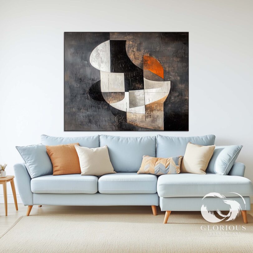 Large geometric abstract painting in black, white, and brown tones hanging on a modern wall.