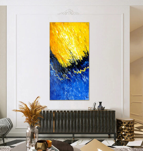 Large abstract artwork featuring bold, energetic brushstrokes in yellow and blue.