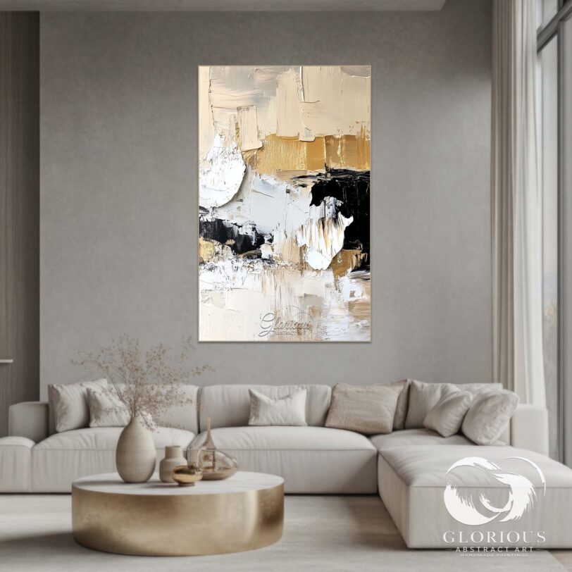 Large abstract canvas painting with beige, black, and gold tones displayed in a modern living room