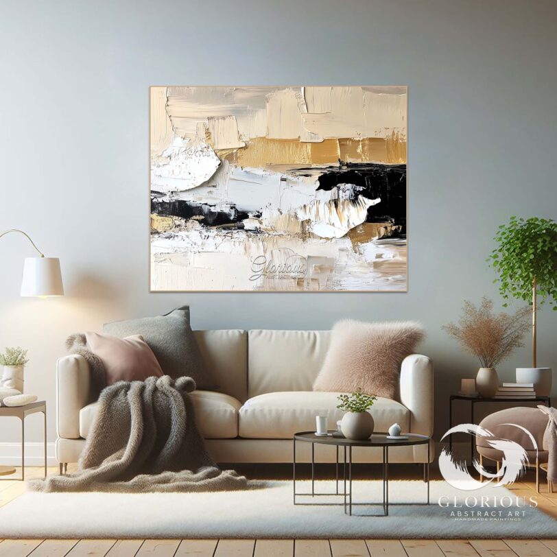 Textured abstract wall art in neutral colors, featuring beige, black, and gold.