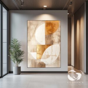 Abstract canvas art with gold and beige shades styled in a modern home office.