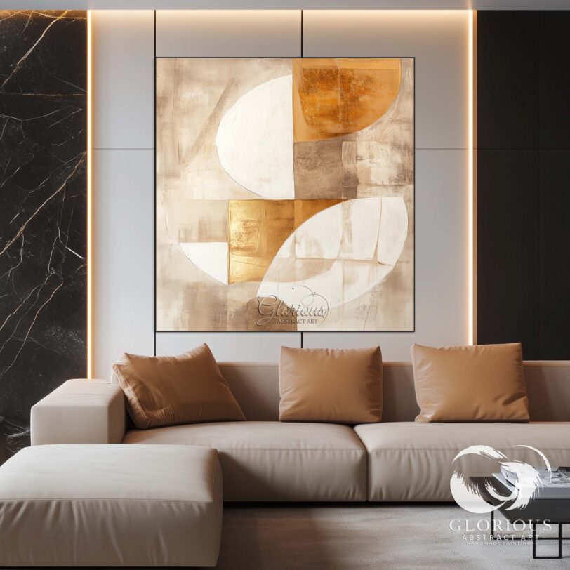 Elegant abstract painting in gold and beige displayed above a sofa