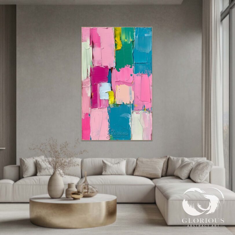 Colorful abstract painting with pink, blue, and yellow blocks on canvas