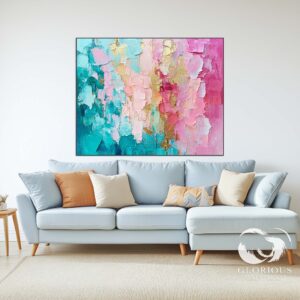 Textured turquoise, pink, and gold abstract art in a contemporary room.