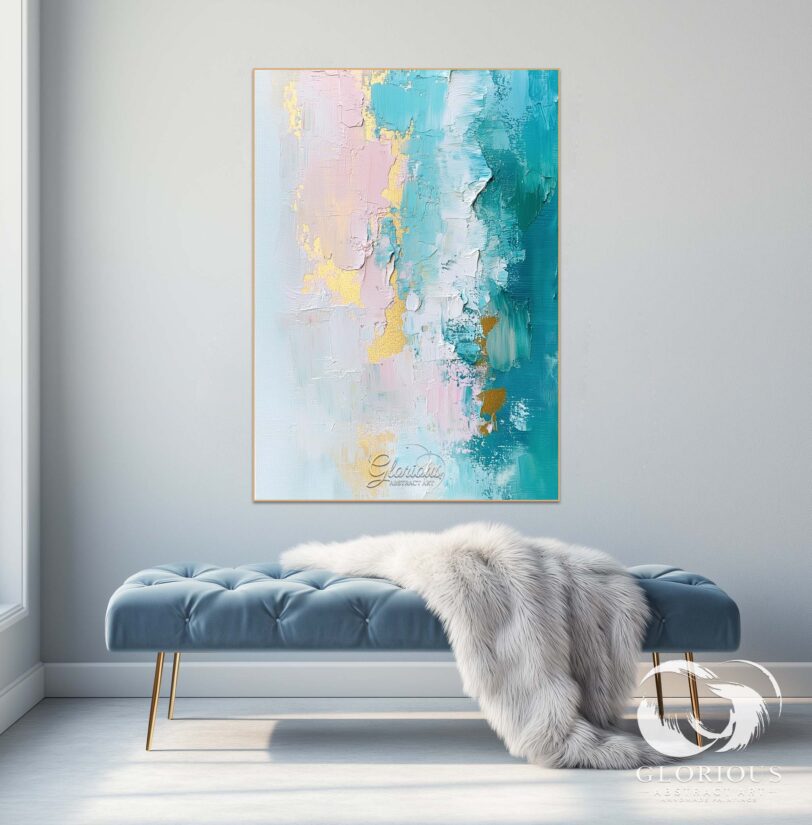 Artistic gold accents on a textured abstract painting with pink and blue tones
