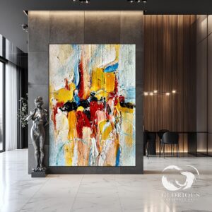 Large abstract painting with vibrant colors on display in a modern interior.