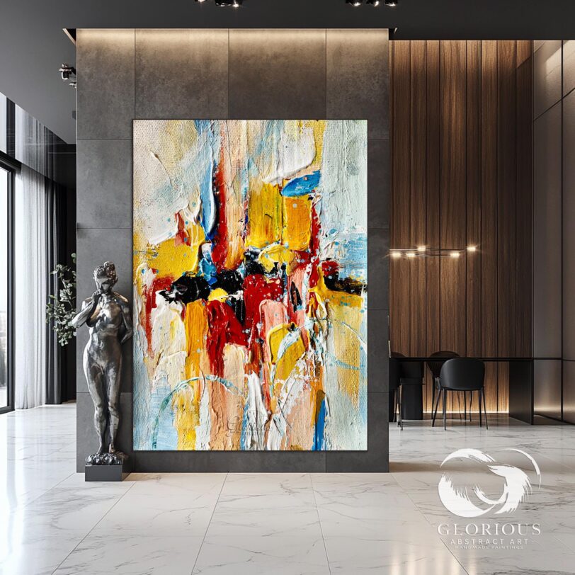 Large abstract painting with vibrant colors on display in a modern interior.