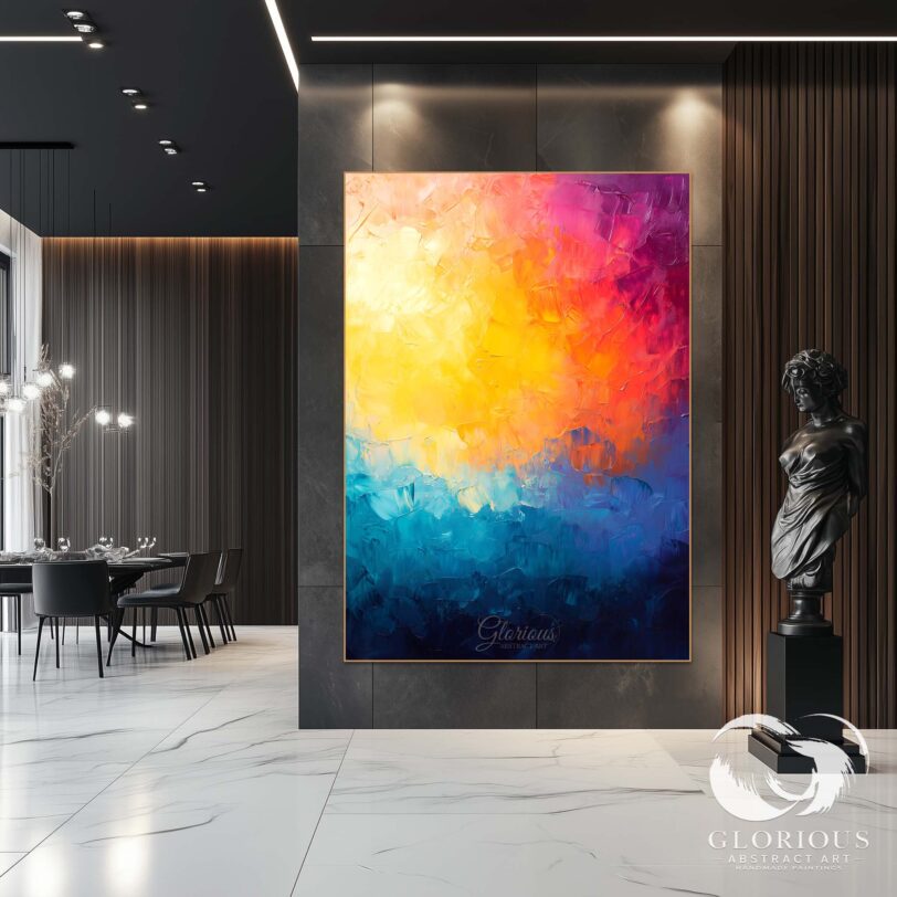 Textured abstract art displayed in a modern workspace, featuring blue and yellow hues.