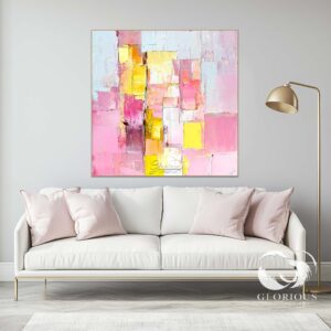 Vibrant pink and yellow abstract painting with bold textures on canvas.