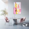 Artistic texture details of pink and yellow abstract painting on canvas.