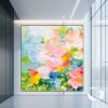 Large abstract floral painting with colorful textures and bold brushstrokes, hung in a contemporary living room.
