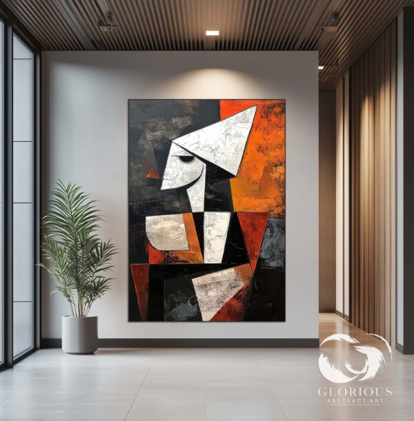 Abstract painting displayed in a living room with modern furniture.