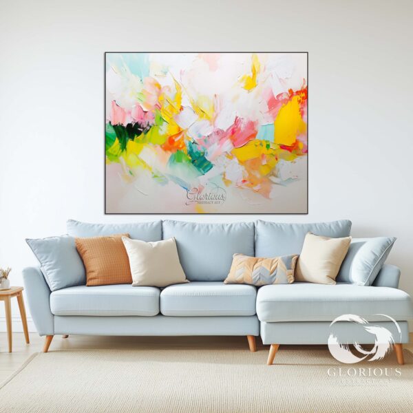 Bright yellow, pink, and green abstract painting displayed in a luxury living space.