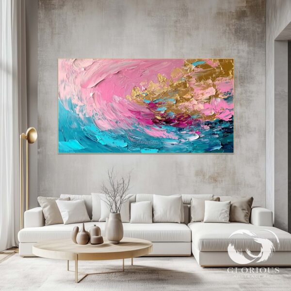 Modern abstract wall decor featuring pink, blue, and gold with a fluid design.