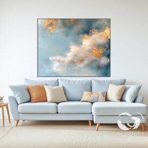 Modern abstract painting styled above a white sofa in a living room.