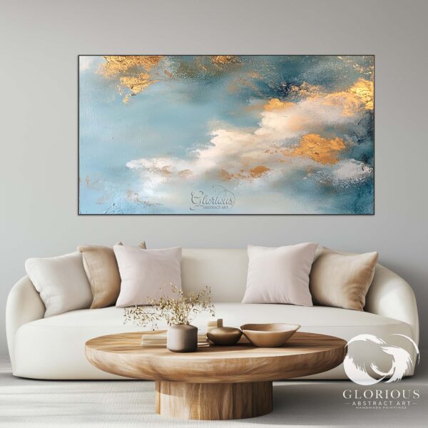 Textured abstract painting in blue and gold tones with cloud-like patterns.