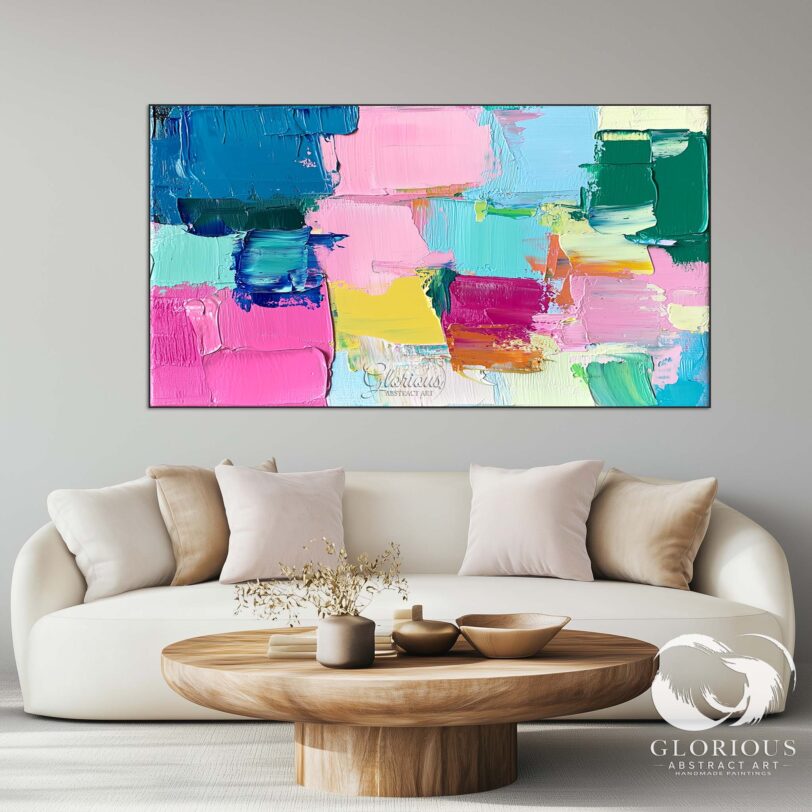 Bold abstract painting with vibrant blue, pink, and yellow textures.